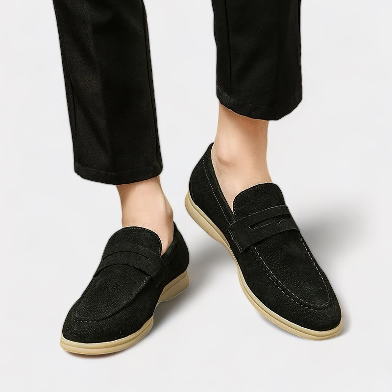 Men's beige luxury loafers with a smooth refined upper and classic timeless silhouette
