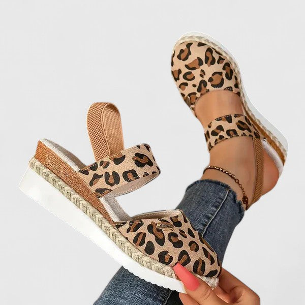A woman in beige espadrille-inspired sandals stepping out comfortably on a bright morning.