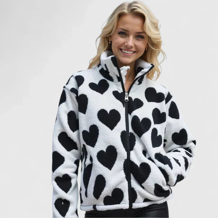A woman wearing a reversible jacket, showing one of its two elegant looks on a day out.