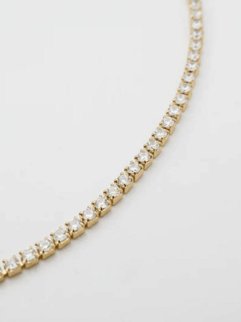 Rivière necklace with a continuous row of crystal stones in gold-plated finish