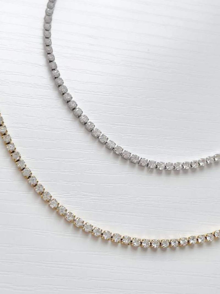 Rivière necklace with a continuous row of crystal stones in gold-plated finish