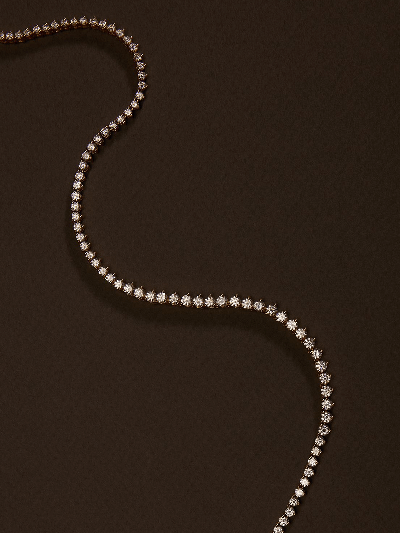 Rivière necklace with a continuous row of crystal stones in gold-plated finish