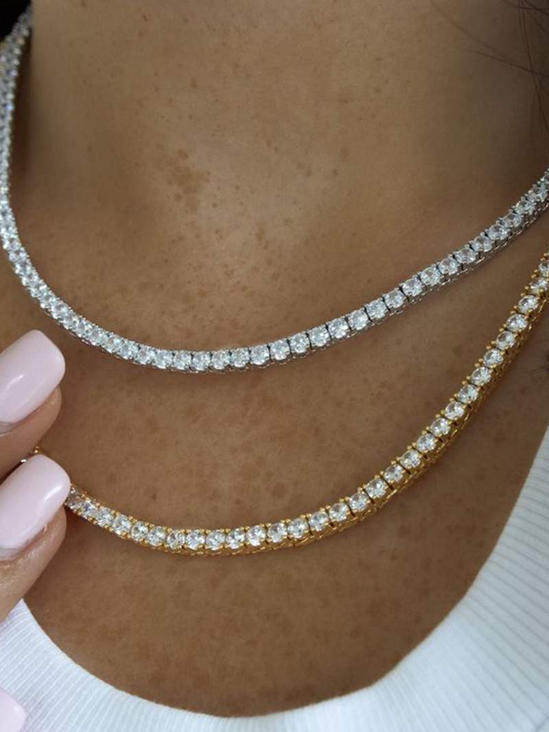 Rivière necklace with a continuous row of crystal stones in gold-plated finish