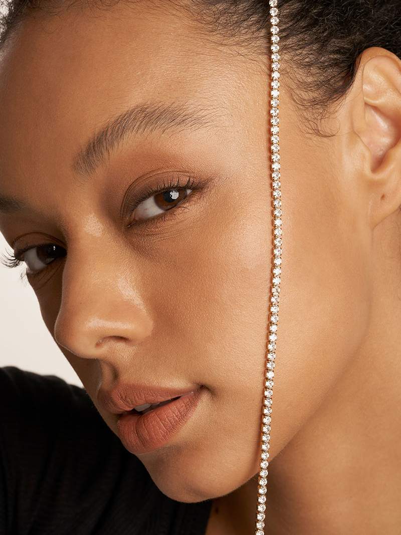 Rivière necklace with a continuous row of crystal stones in gold-plated finish