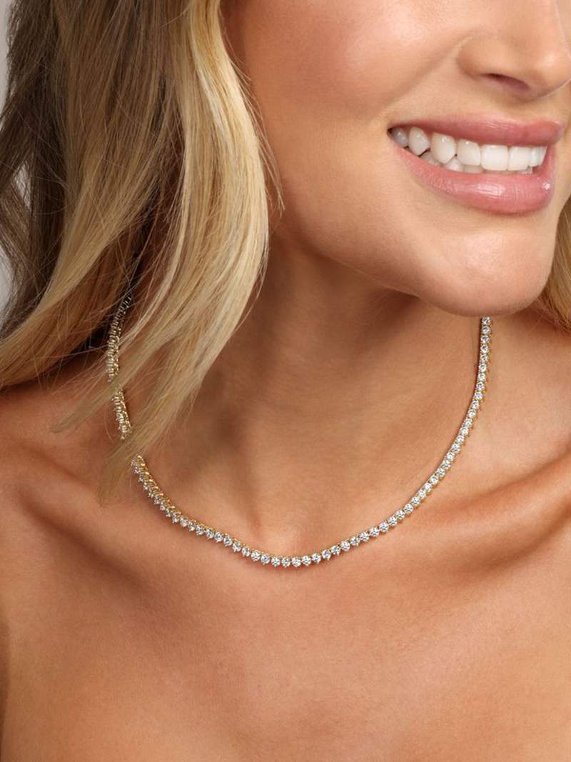 Rivière necklace with a continuous row of crystal stones in gold-plated finish