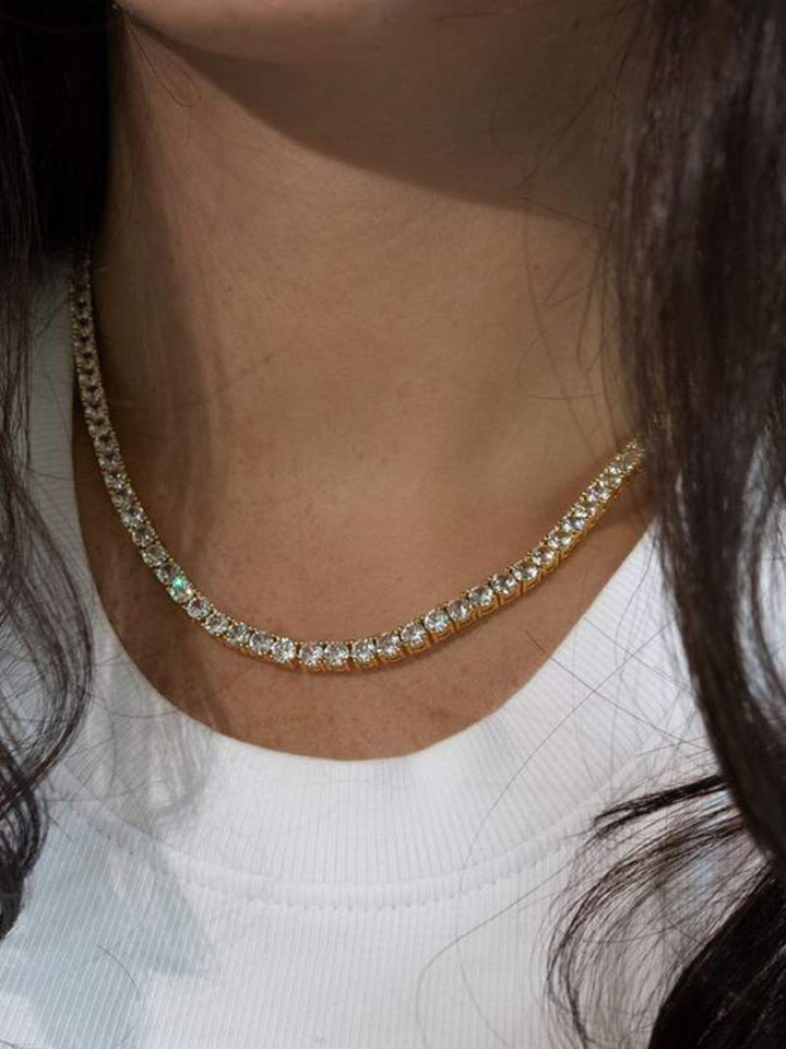 Rivière necklace with a continuous row of crystal stones in gold-plated finish