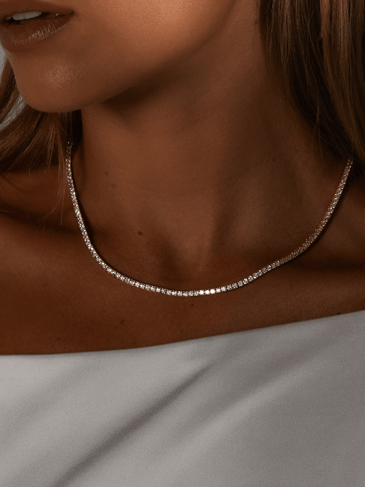 Rivière necklace with a continuous row of crystal stones in gold-plated finish