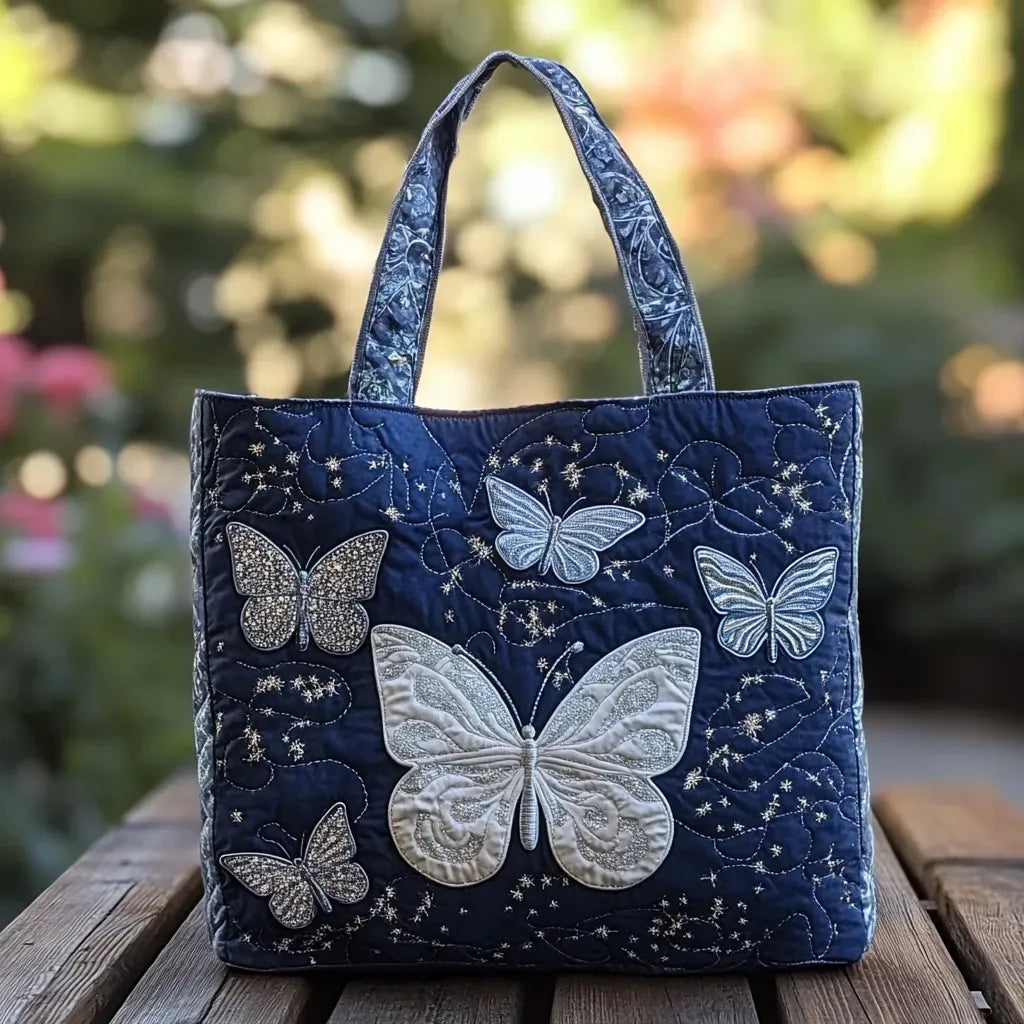 Quilted tote bag with a shimmering silver butterfly with delicate wing detail