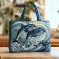 Quilted tote bag with a dolphin leaping through blue ocean waves