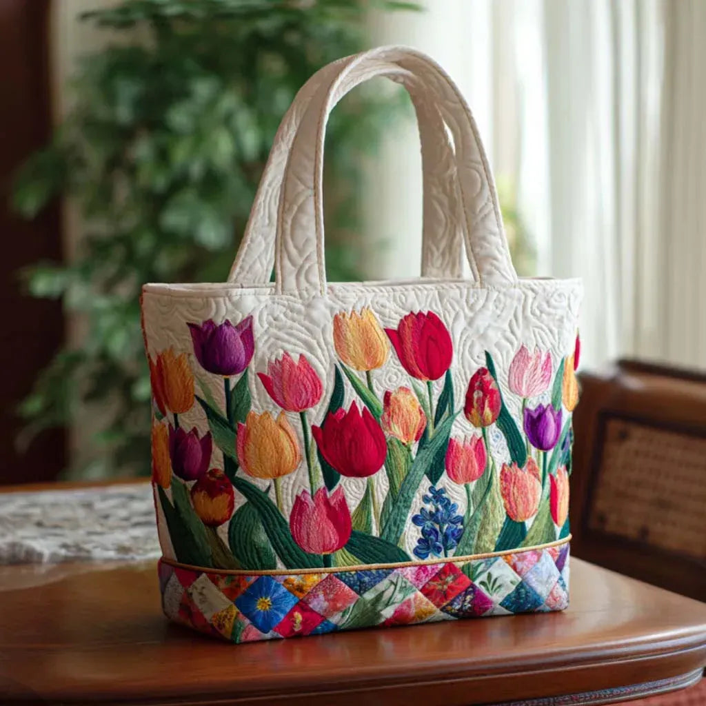 Quilted tote bag with a colourful tulip garden pattern and wave-stitch finish