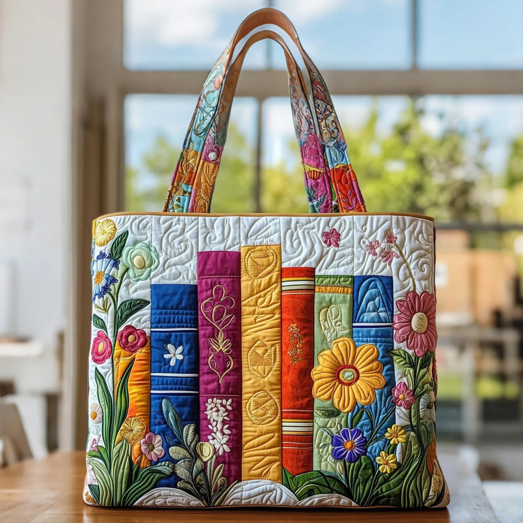 Quilted tote bag with a romantic floral library motif of books and blooms on a padded structured body