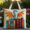 Quilted tote bag with an emerald green dragon coiled around a stack of books on a padded structured body