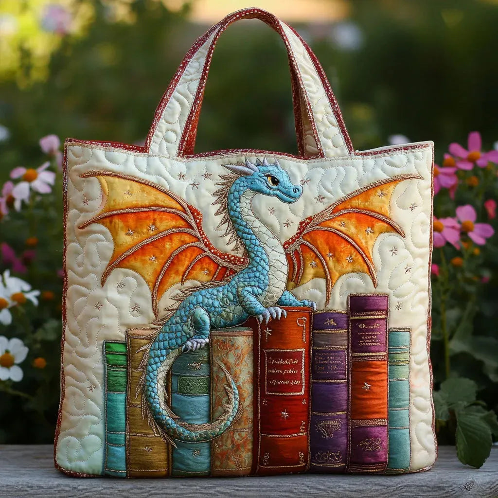 Quilted tote bag with an emerald green dragon coiled around a stack of books on a padded structured body