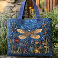Quilted tote bag with a golden dragonfly with iridescent wings on a dark background