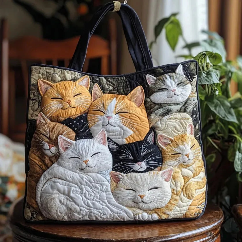 Quilted tote bag with a cluster of sleeping kittens curled up together