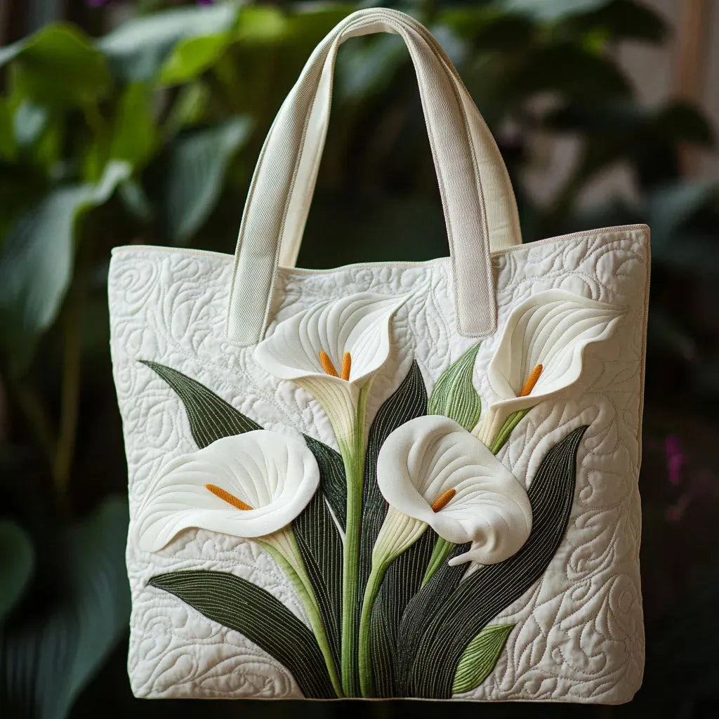 Quilted tote bag with a classic white lily floral print on a structured wave-stitch body