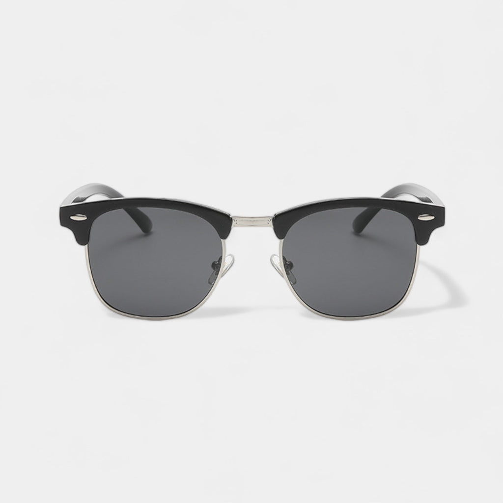 Men's vintage classic sunglasses in black and gold with a refined, understated frame