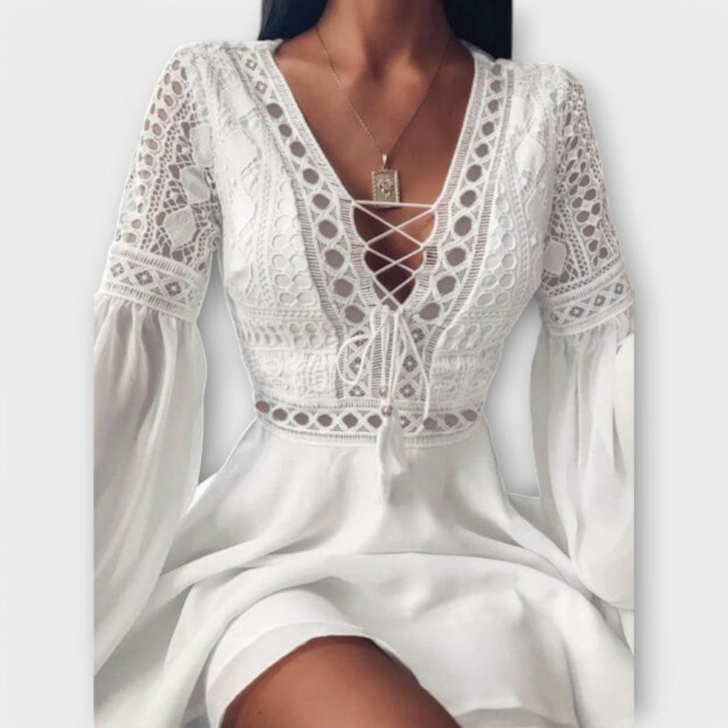 White short boho dress with delicate openwork trim, V-neckline tie and voluminous sleeves