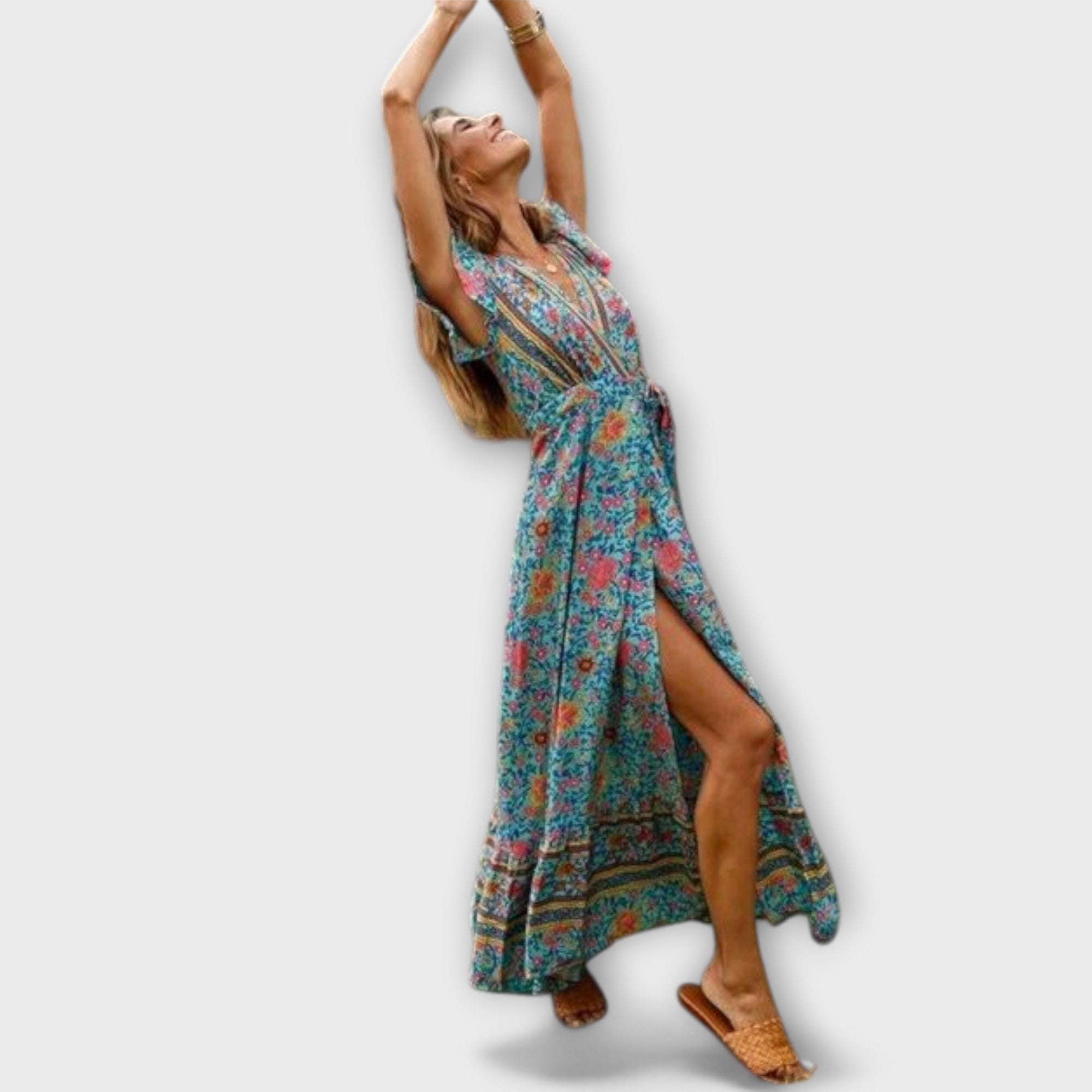 A flowing floral boho maxi dress in blue with a V-neckline, styled for a summer outing
