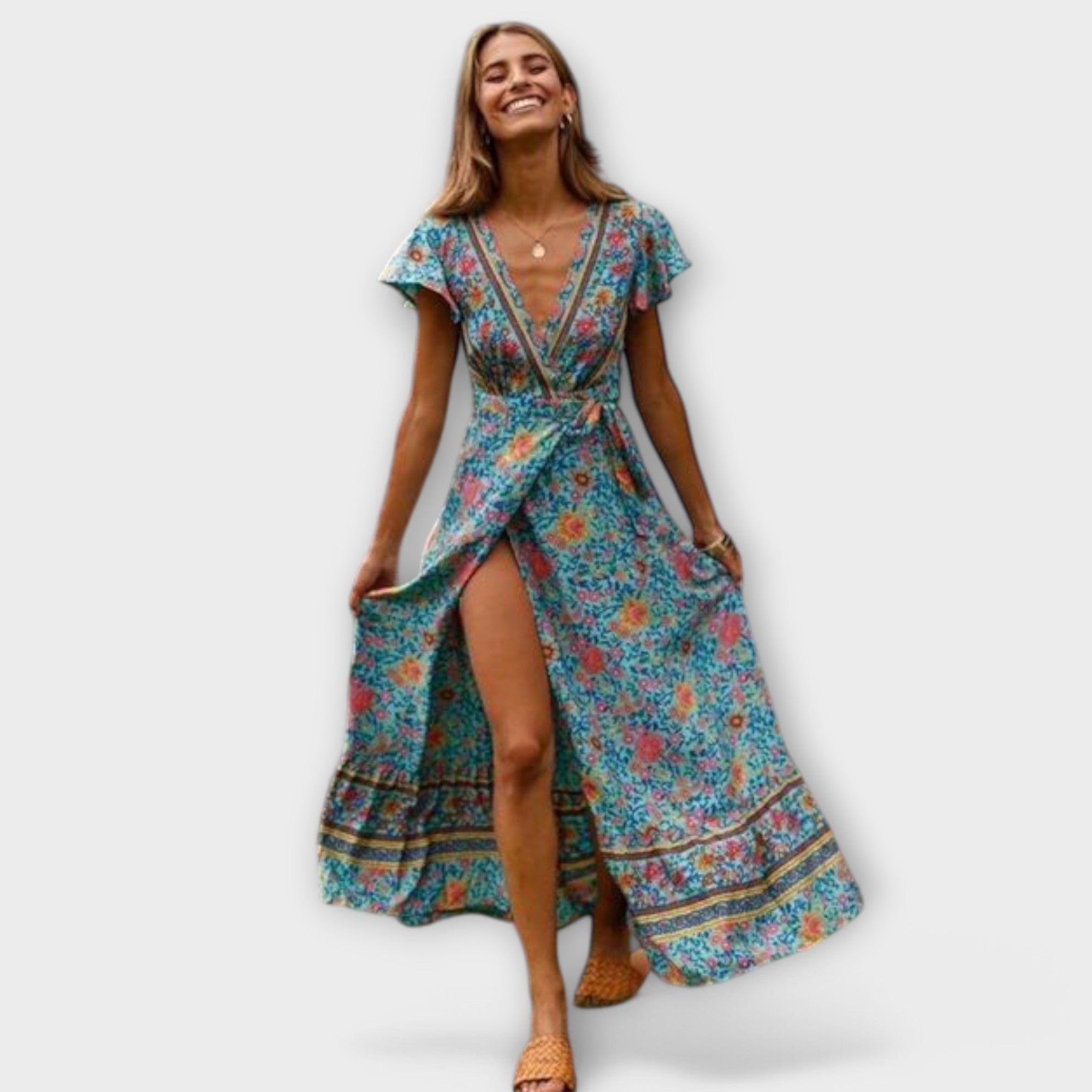 A flowing floral boho maxi dress in blue with a V-neckline, styled for a summer outing