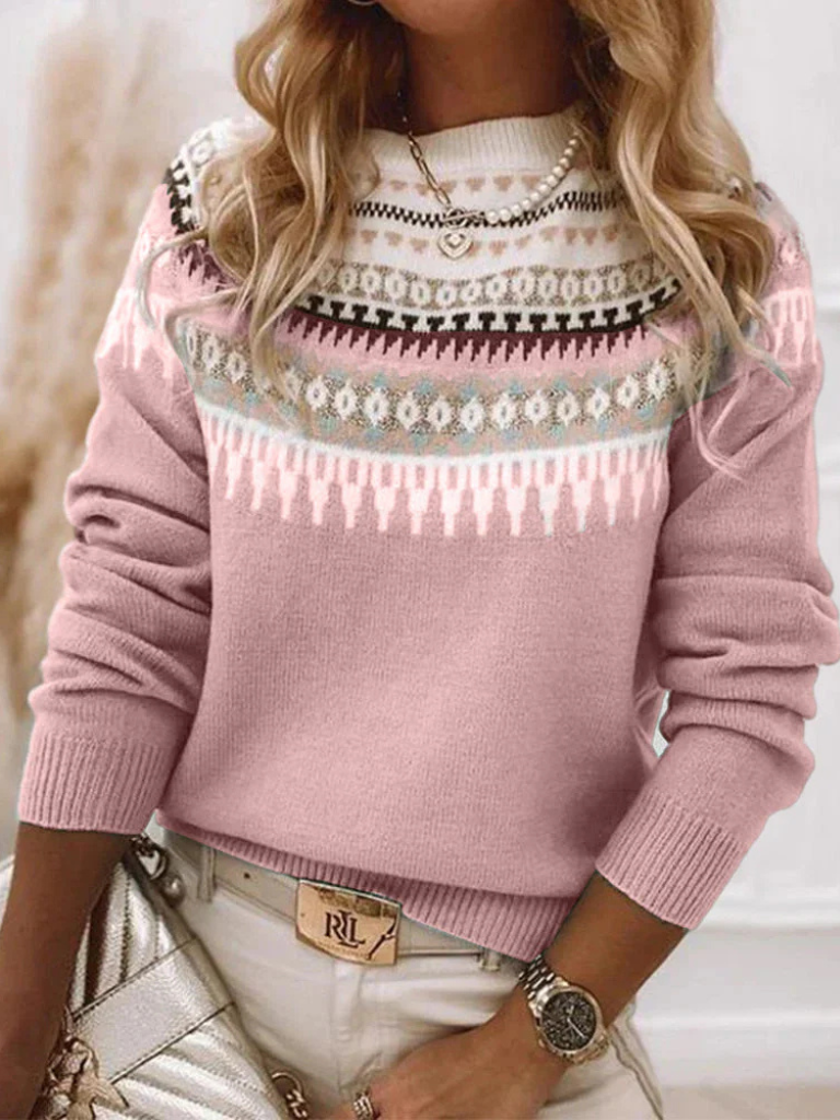 A woman wearing a soft jumper with a cream, black and beige Nordic pattern, warm and elegant.
