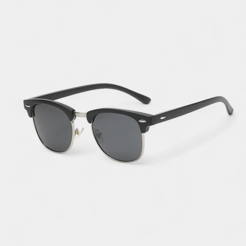 Men's vintage classic sunglasses in black and gold with a refined, understated frame