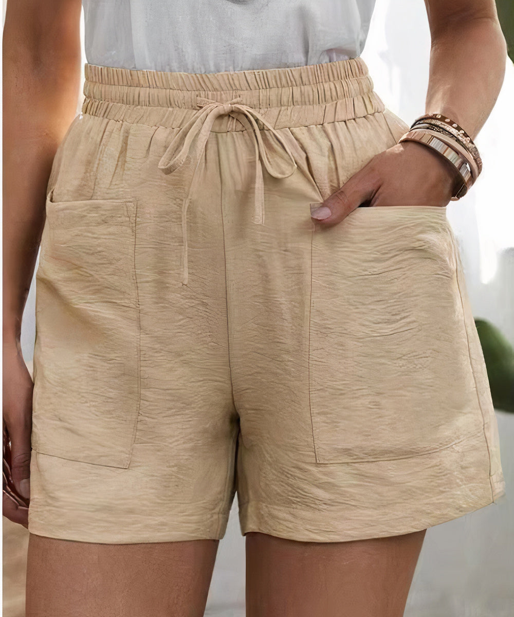 High-waist women's shorts in a range of vibrant colours including purple, orange, and green