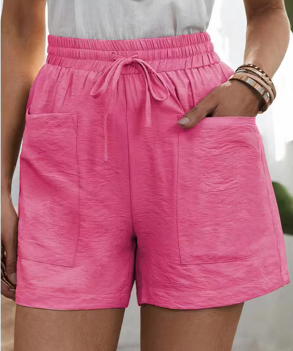 High-waist women's shorts in a range of vibrant colours including purple, orange, and green
