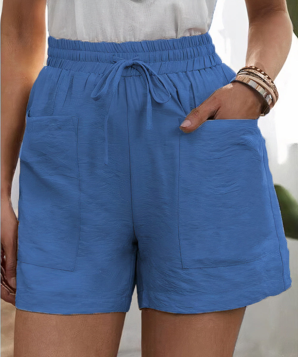 High-waist women's shorts in a range of vibrant colours including purple, orange, and green