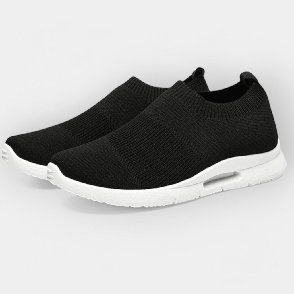 Women's cushioned walking trainers in black with a supportive ergonomic sole