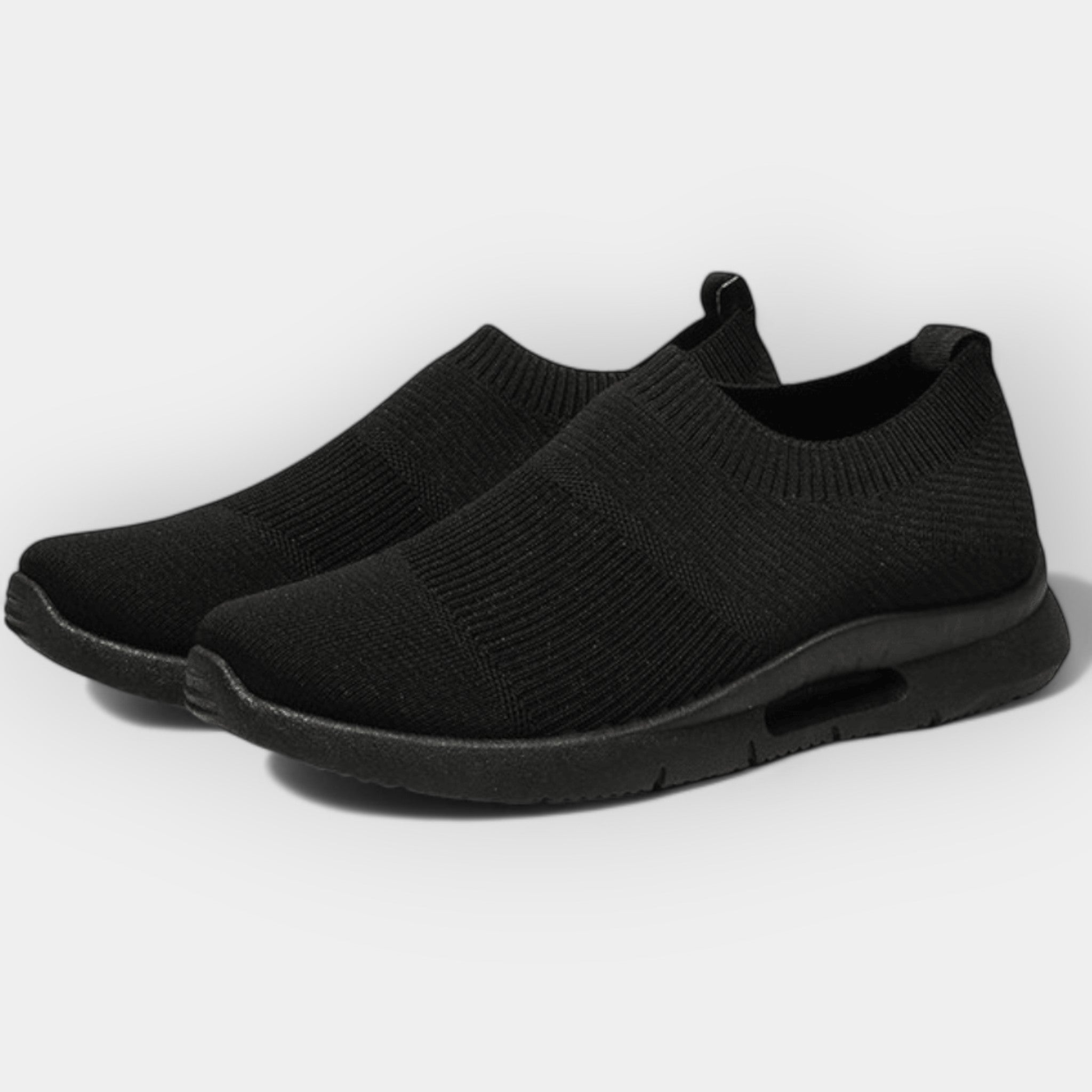 Women's cushioned walking trainers in black with a supportive ergonomic sole