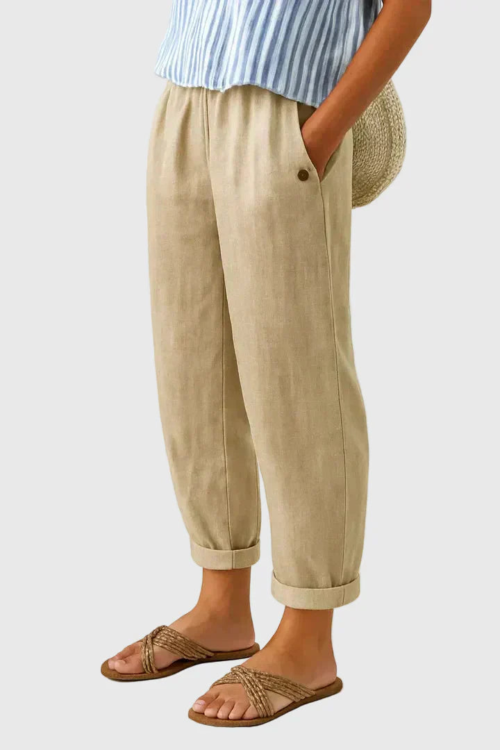 A woman wearing chic comfy trousers with a modern relaxed cut and flattering silhouette.