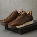 Men's brown elegant lace-up boots with a smooth refined upper and cushioned sole