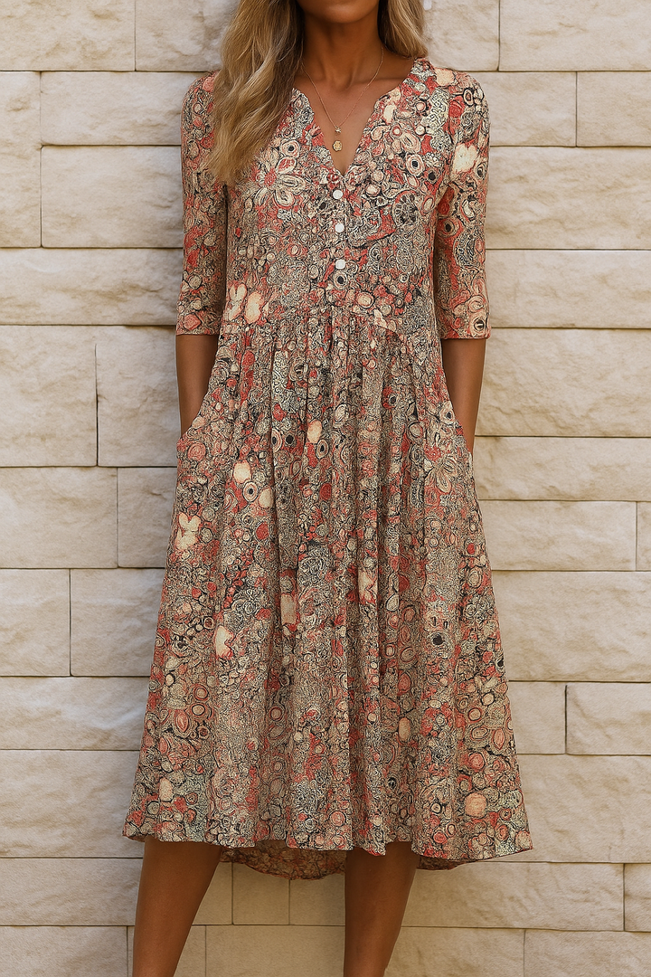 Woman wearing the Laura elegant V-neck dress with three-quarter sleeves, walking through a city street.