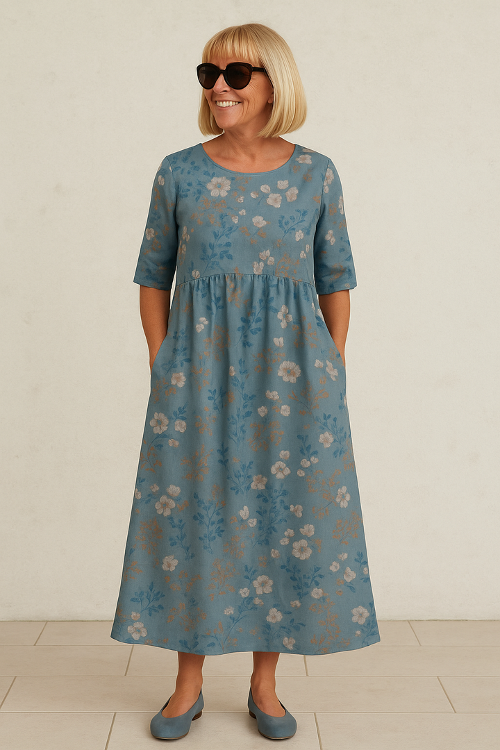 A woman wearing the Una relaxed floral midi dress with an A-line skirt, out for a daytime stroll.