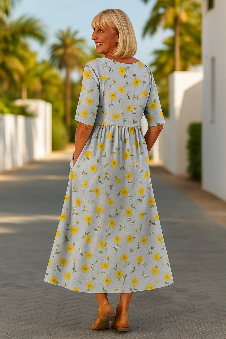 A woman wearing the Una relaxed floral midi dress with an A-line skirt, out for a daytime stroll.