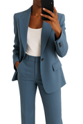 Women's tailored blazer and trouser suit set in navy blue with a clean, structured silhouette