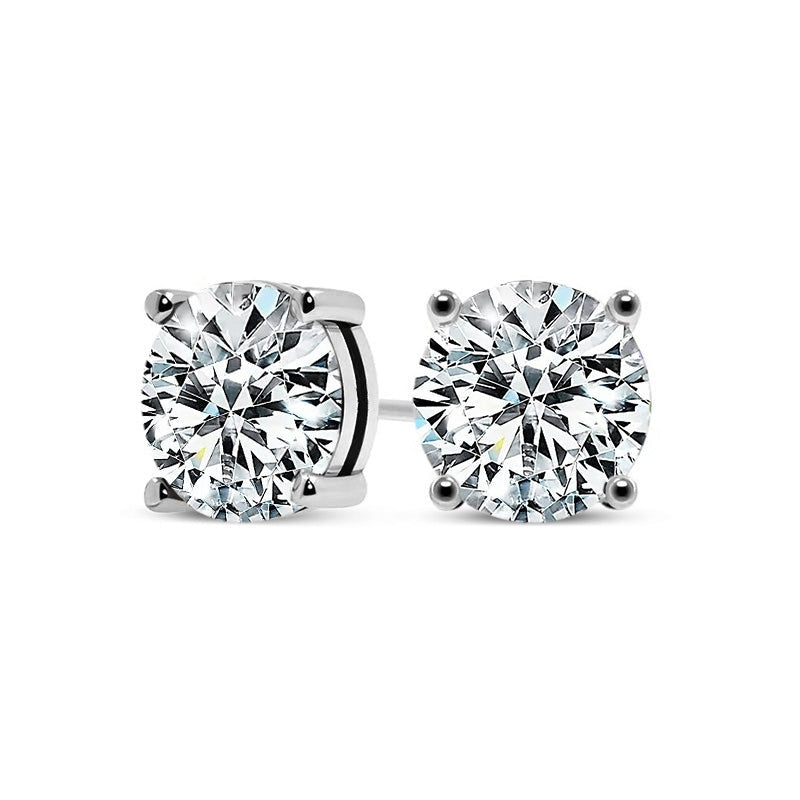 A pair of handcrafted sterling silver stud earrings with a curved, polished minimalist design