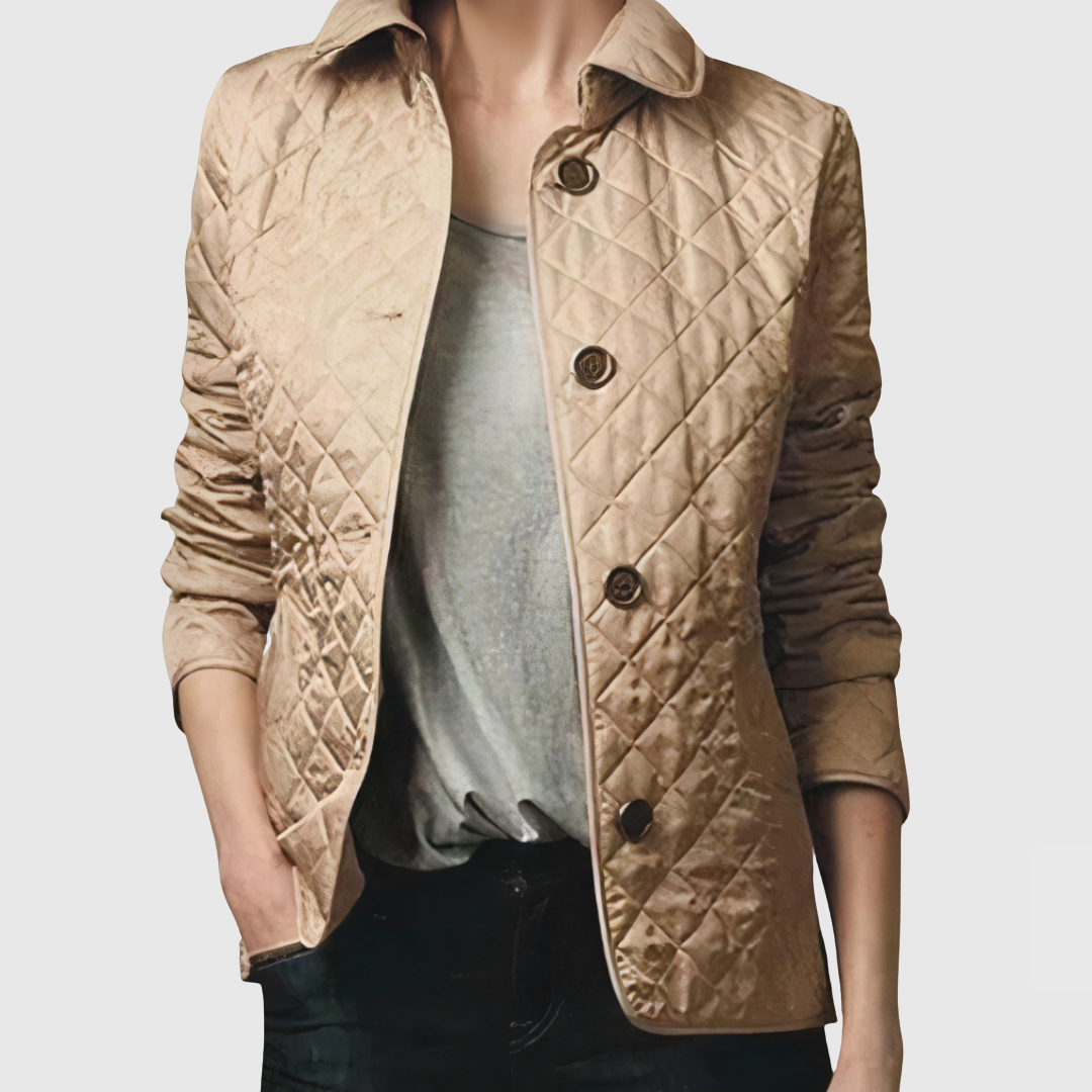 A woman wearing an autumn jacket over a top, layered for a crisp day in town.