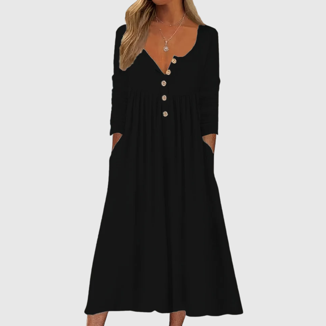 A woman wearing the Bernadette button-front midi dress with an A-line skirt, dressed for a casual day out.