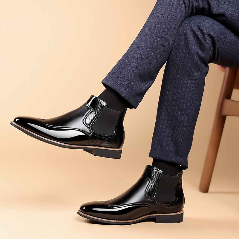Men's brown classic Chelsea boots with elastic side panels and a smooth structured upper