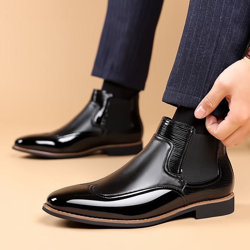 Men's brown classic Chelsea boots with elastic side panels and a smooth structured upper