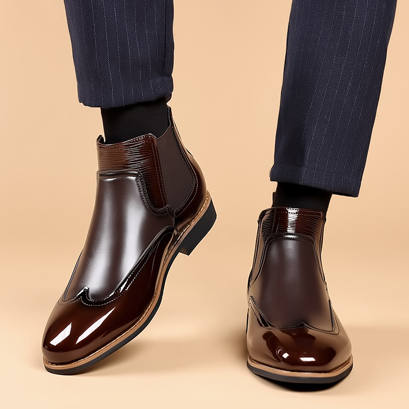 Men's brown classic Chelsea boots with elastic side panels and a smooth structured upper
