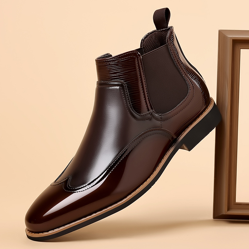 Men's brown classic Chelsea boots with elastic side panels and a smooth structured upper