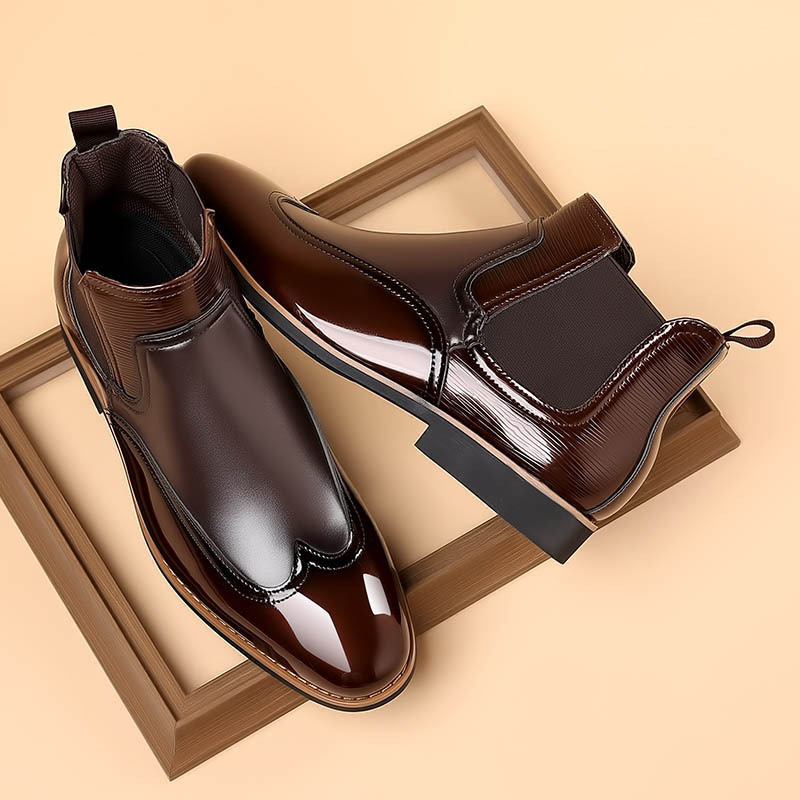 Men's brown classic Chelsea boots with elastic side panels and a smooth structured upper