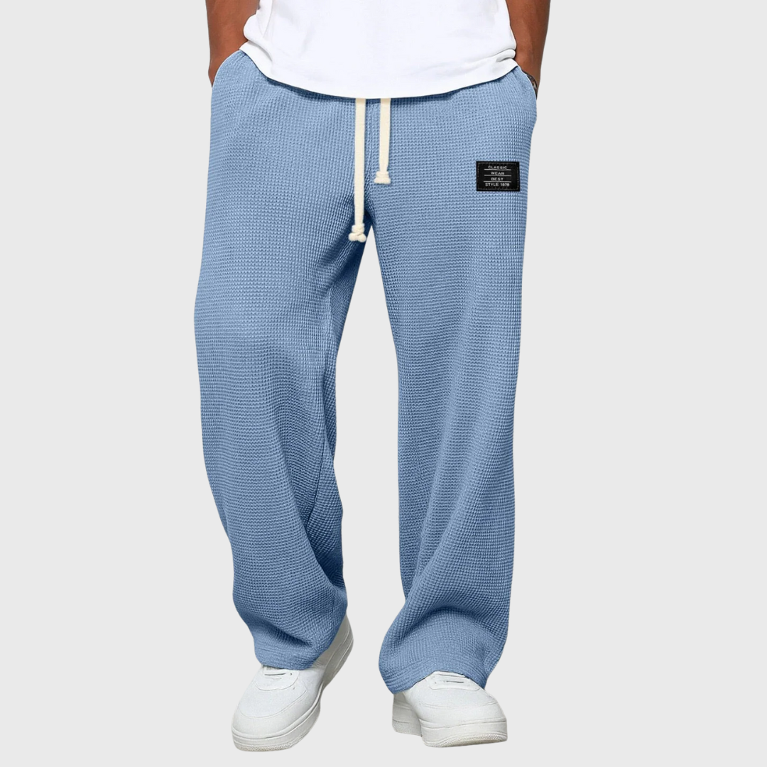 Men's wide-leg drawstring trousers in grey with a relaxed silhouette and elasticated waist
