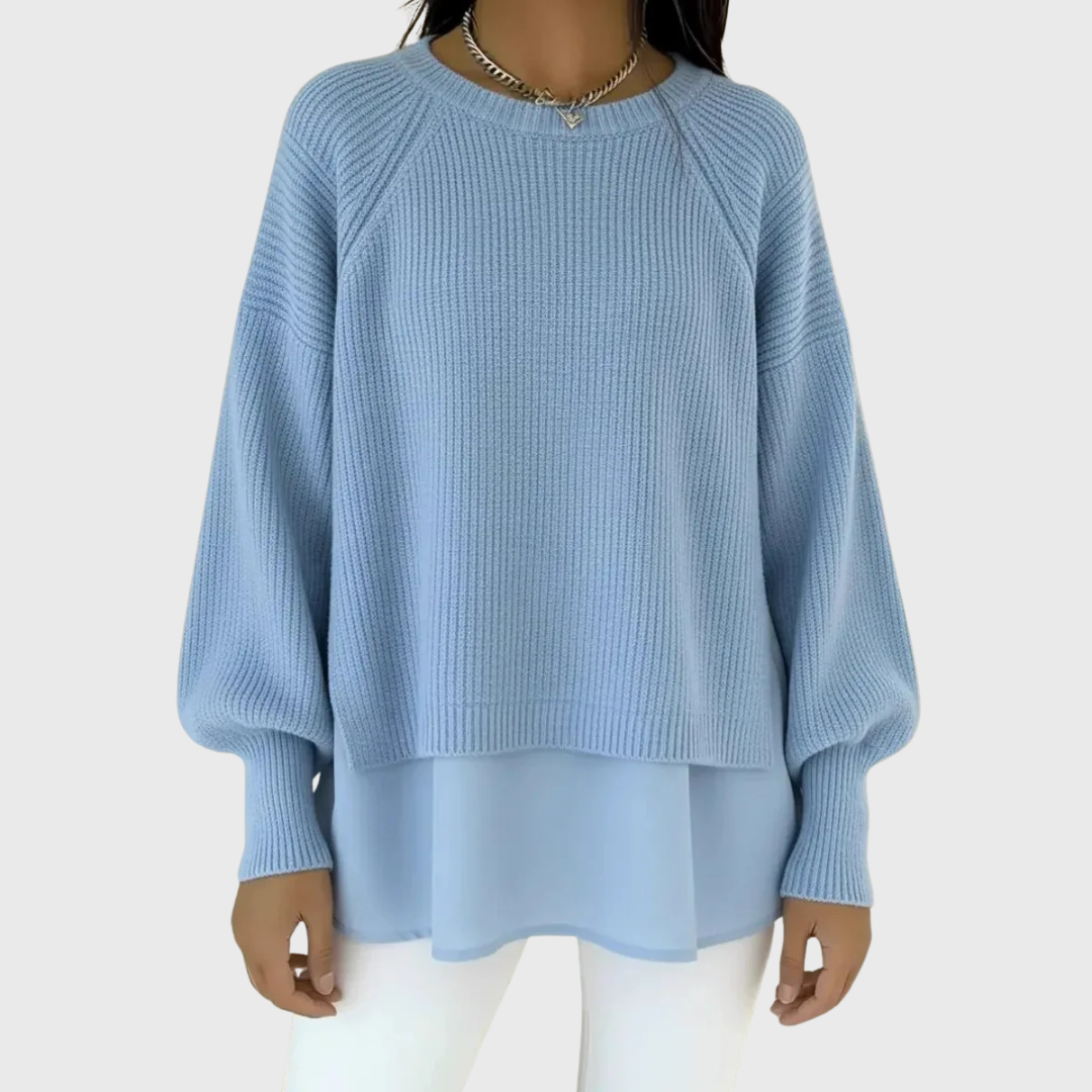 Layered knit top in light blue with a soft structured upper and loose floaty hem
