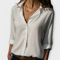 Classic collar pleated-front blouse with three-quarter sleeves in a refined, flowing shape