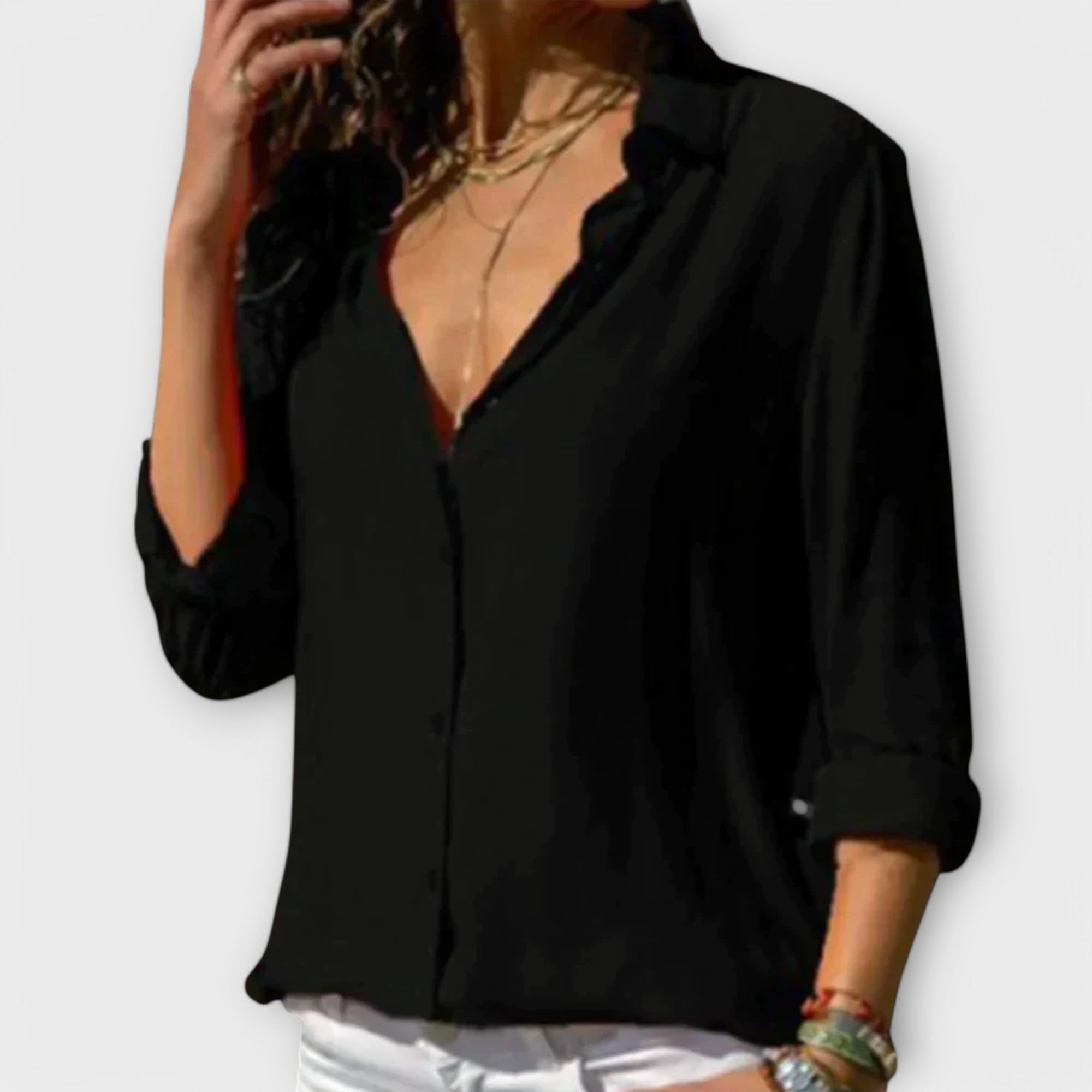 Classic white blouse with pleat-front detail, refined collar and three-quarter sleeves