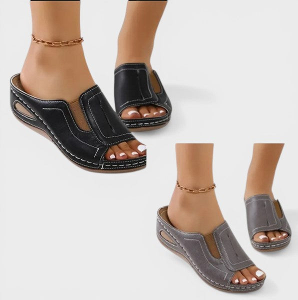 Women's orthopedic sandals in black with a cushioned footbed and lightweight strapped upper